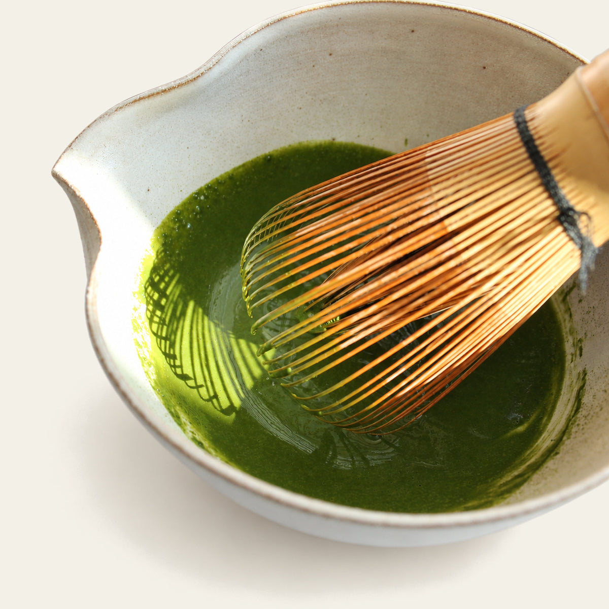 Matcha bowl with  matcha paste and whisk