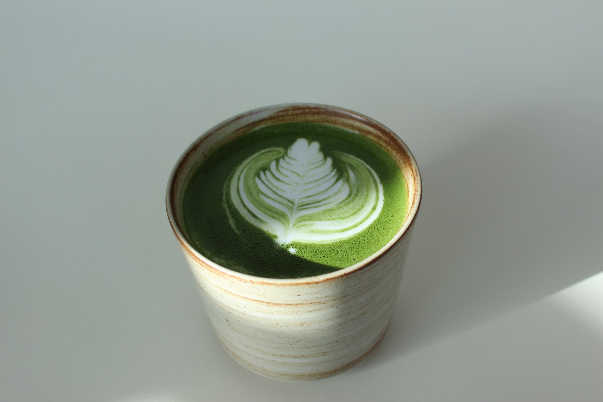 Matcha latte in a stoneware cup