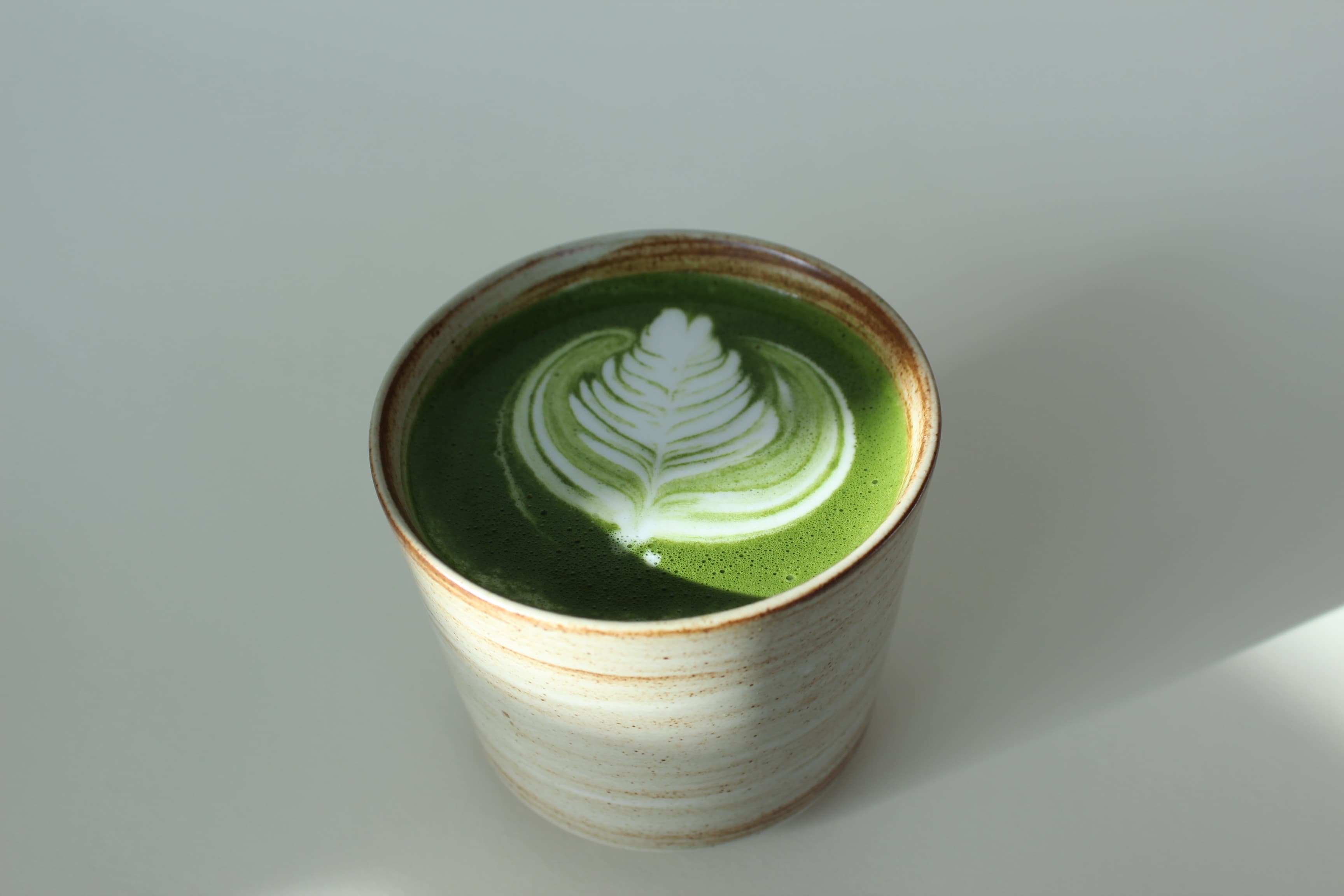 Matcha latte in a stoneware cup